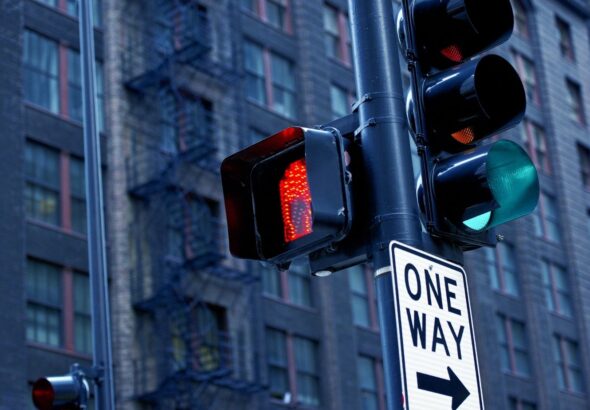 a green arrow showing with a red traffic light means