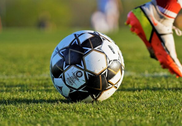 Football on field representing sports betting